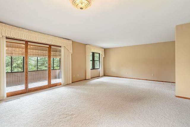 1200 18th Ave NW Unit 132, Austin, MN 55912 - spare room with light carpet and baseboards