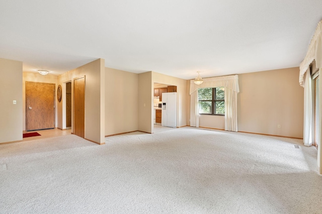 1200 18th Ave NW Unit 132, Austin, MN 55912 - unfurnished living room featuring light colored carpet