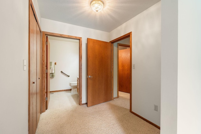 1200 18th Ave NW Unit 132, Austin, MN 55912 - hallway with light colored carpet and baseboards