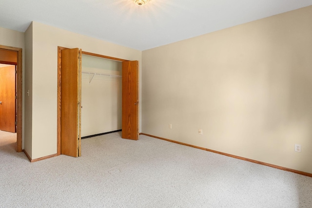 1200 18th Ave NW Unit 132, Austin, MN 55912 - unfurnished bedroom with a closet and carpet floors
