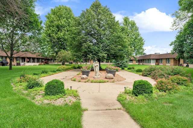 1200 18th Ave NW Unit 132, Austin, MN 55912 - view of community with a lawn