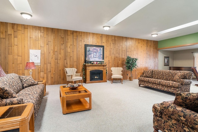 1200 18th Ave NW Unit 132, Austin, MN 55912 - carpeted living room featuring wooden walls, a warm lit fireplace, and a skylight