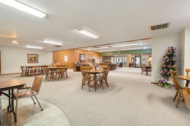 1200 18th Ave NW Unit 132, Austin, MN 55912 - carpeted dining room featuring wooden walls