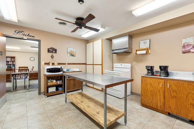 1200 18th Ave NW Unit 132, Austin, MN 55912 - kitchen with white appliances, a ceiling fan, brown cabinets, light tile patterned floors, and light countertops