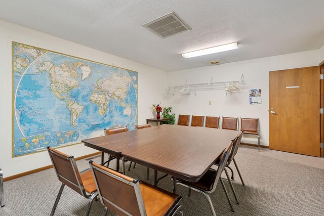 1200 18th Ave NW Unit 132, Austin, MN 55912 - dining room featuring light carpet and a textured ceiling