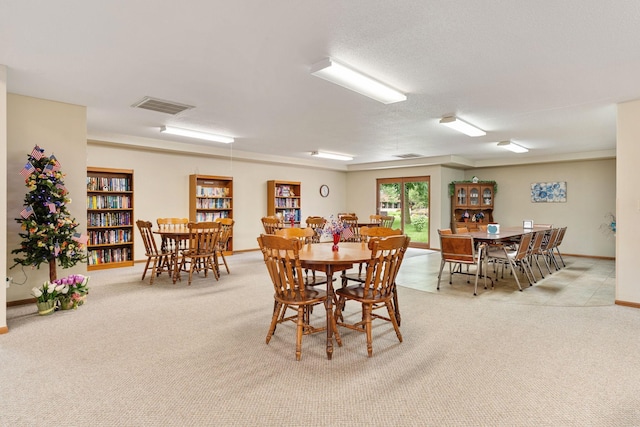 1200 18th Ave NW Unit 132, Austin, MN 55912 - dining area featuring light carpet and baseboards