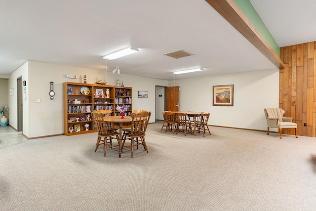 1200 18th Ave NW Unit 132, Austin, MN 55912 - carpeted dining area with wooden walls and baseboards