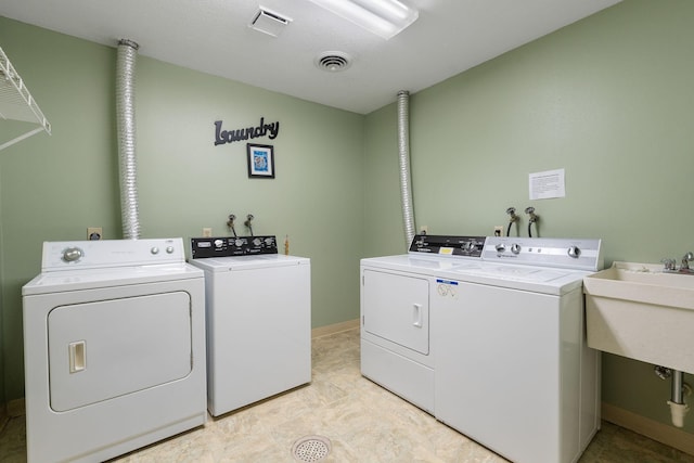 1200 18th Ave NW Unit 132, Austin, MN 55912 - washroom with separate washer and dryer and a sink