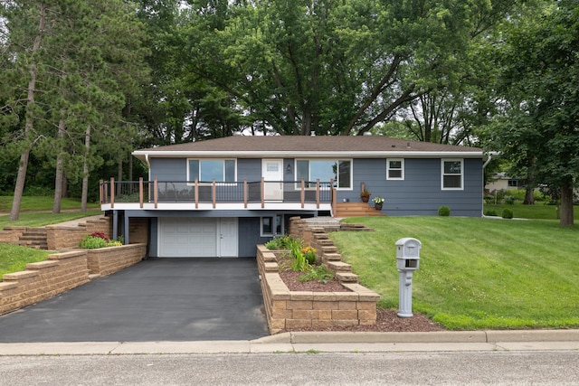 728 Linn St N, Prescott, WI 54021 - ranch-style house with driveway, stairs, a deck, a garage, and a front yard