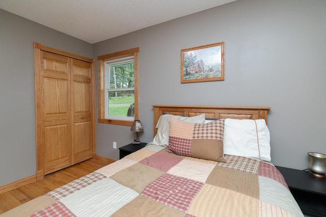 728 Linn St N, Prescott, WI 54021 - bedroom featuring light wood-style flooring and a closet