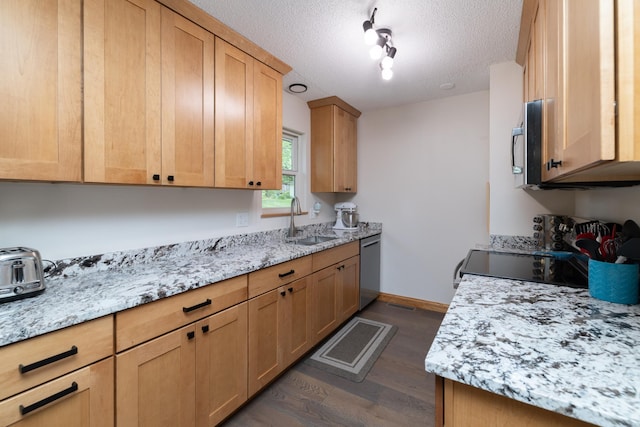 728 Linn St N, Prescott, WI 54021 - kitchen with a textured ceiling, dark wood-type flooring, appliances with stainless steel finishes, light stone counters, and rail lighting