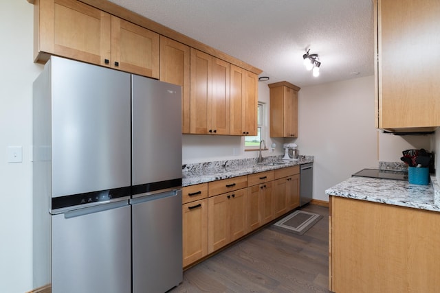 728 Linn St N, Prescott, WI 54021 - kitchen with appliances with stainless steel finishes, dark wood-type flooring, a textured ceiling, light stone countertops, and light brown cabinets