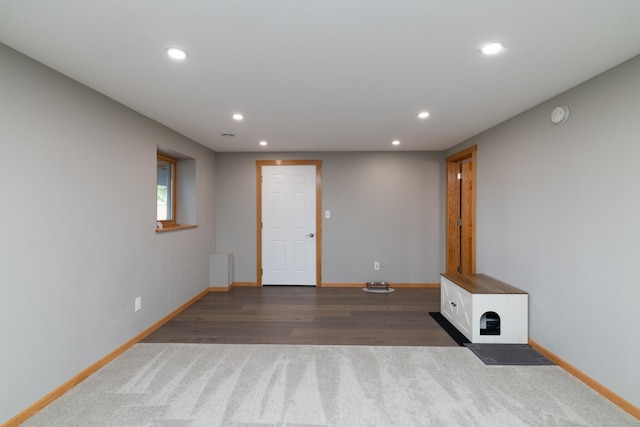 728 Linn St N, Prescott, WI 54021 - unfurnished living room featuring recessed lighting, dark carpet, and dark wood finished floors