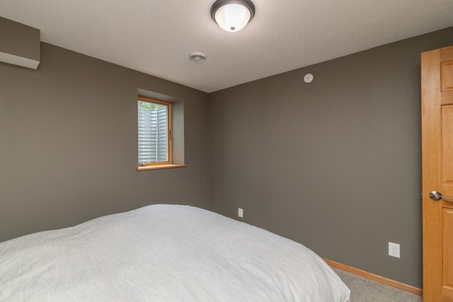 728 Linn St N, Prescott, WI 54021 - carpeted bedroom featuring baseboards and a textured ceiling