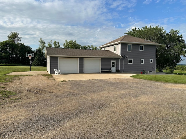 1865 180th St, Norman Twp, MN 56220 - rear view of property with dirt driveway, an outbuilding, a garage, and a lawn