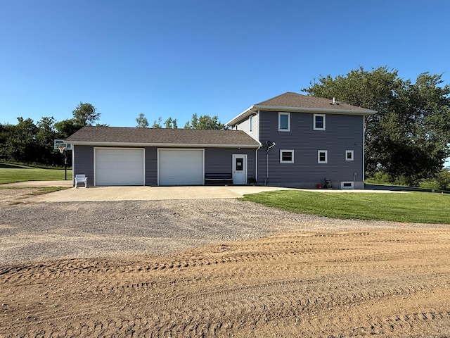 1865 180th St, Norman Twp, MN 56220 - view of front facade featuring driveway, a front lawn, and an outdoor structure