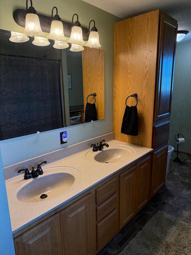 1865 180th St, Norman Twp, MN 56220 - bathroom featuring double vanity and toilet