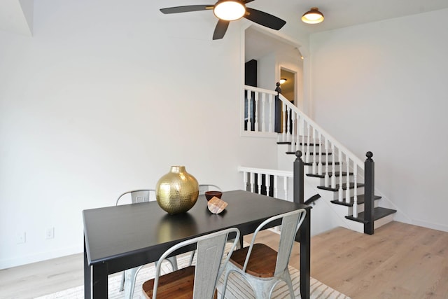 10419 Goldenrod St NW, Coon Rapids, MN 55448 - dining space with a ceiling fan, wood finished floors, and stairs