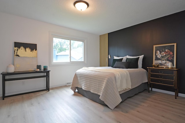 10419 Goldenrod St NW, Coon Rapids, MN 55448 - bedroom featuring wood finished floors and baseboards