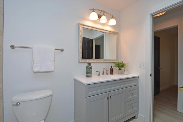 10419 Goldenrod St NW, Coon Rapids, MN 55448 - bathroom with vanity and wood finished floors