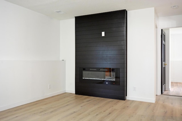 10419 Goldenrod St NW, Coon Rapids, MN 55448 - detailed view of wood finished floors and a smoke detector