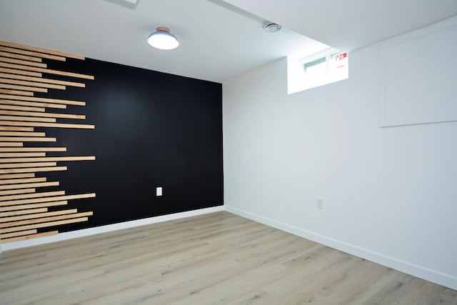 10419 Goldenrod St NW, Coon Rapids, MN 55448 - unfurnished room featuring wood finished floors and baseboards
