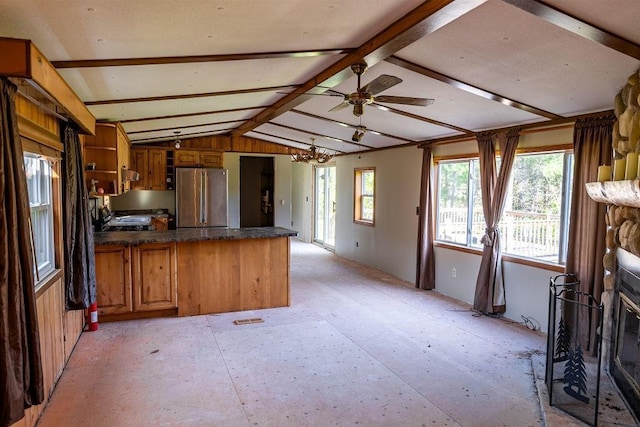 N5172 County Road O, Atlanta Twp, WI 54819 - kitchen with freestanding refrigerator, a peninsula, dark countertops, a chandelier, and brown cabinetry