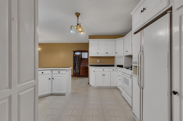 213 2nd St N, Cold Spring, MN 56320 - kitchen featuring white appliances, white cabinets, a peninsula, pendant lighting, and light tile patterned flooring