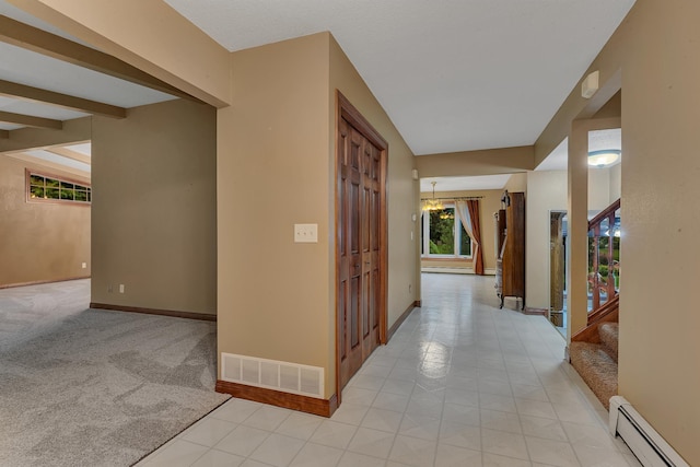 213 2nd St N, Cold Spring, MN 56320 - hallway featuring baseboard heating, a chandelier, light carpet, stairs, and light tile patterned floors