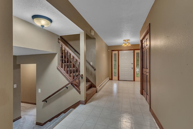 213 2nd St N, Cold Spring, MN 56320 - foyer with a baseboard heating unit, a textured ceiling, and stairs