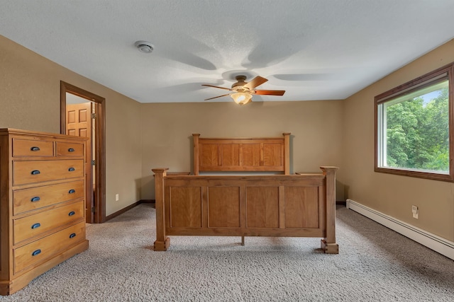 213 2nd St N, Cold Spring, MN 56320 - bedroom with a baseboard heating unit, light colored carpet, and ceiling fan