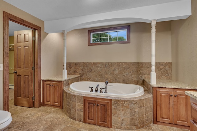 213 2nd St N, Cold Spring, MN 56320 - bathroom featuring a bath and a baseboard radiator