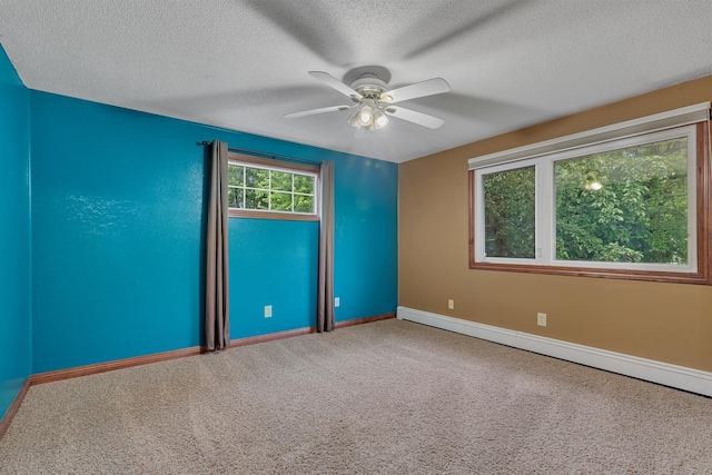 213 2nd St N, Cold Spring, MN 56320 - carpeted empty room featuring a baseboard radiator, ceiling fan, and a textured ceiling