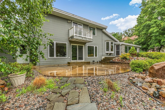213 2nd St N, Cold Spring, MN 56320 - back of house featuring a balcony and a patio area