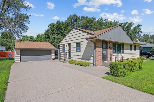 5913 Zenith Ave N, Brooklyn Center, MN 55429 - view of front of home featuring a detached garage, brick siding, and an outdoor structure