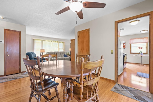 5913 Zenith Ave N, Brooklyn Center, MN 55429 - dining room featuring light wood-style flooring and a ceiling fan