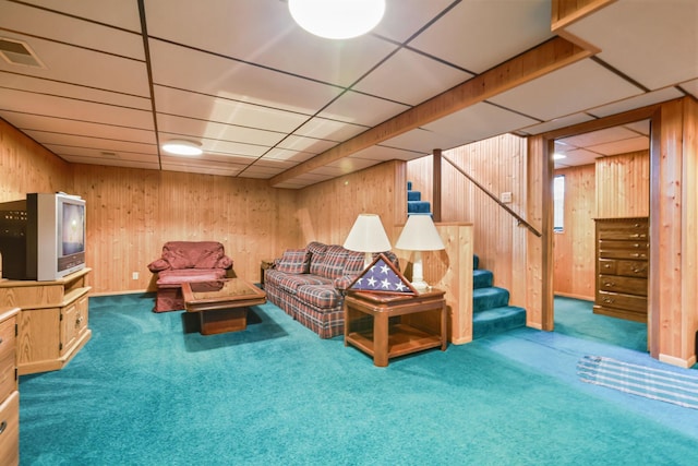 5913 Zenith Ave N, Brooklyn Center, MN 55429 - living room featuring carpet flooring, stairs, wooden walls, and a paneled ceiling