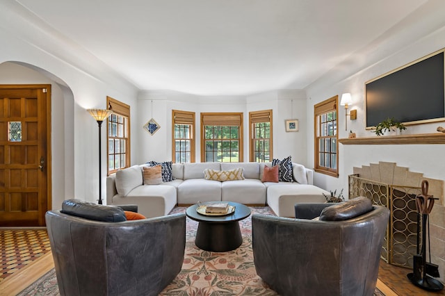 704 58th St, Minneapolis, MN 55417 - living area with arched walkways and a fireplace