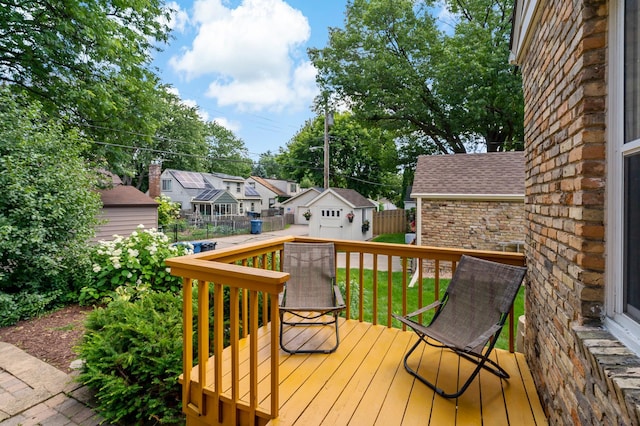 704 58th St, Minneapolis, MN 55417 - wooden terrace featuring a fenced backyard, an outdoor structure, and a residential view