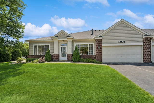 13936 54th Ave N Unit 2, Plymouth, MN 55446 - view of front of house with brick siding, asphalt driveway, and a front lawn