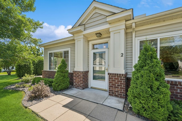 13936 54th Ave N Unit 2, Plymouth, MN 55446 - property entrance with brick siding and a lawn