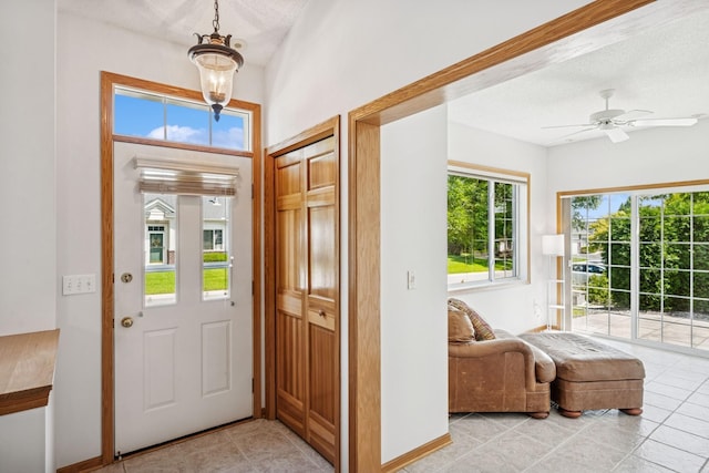 13936 54th Ave N Unit 2, Plymouth, MN 55446 - entryway featuring light tile patterned flooring and a ceiling fan
