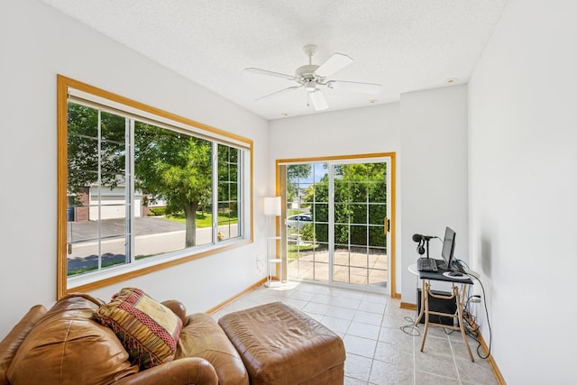 13936 54th Ave N Unit 2, Plymouth, MN 55446 - living area with light tile patterned floors, a ceiling fan, and a textured ceiling