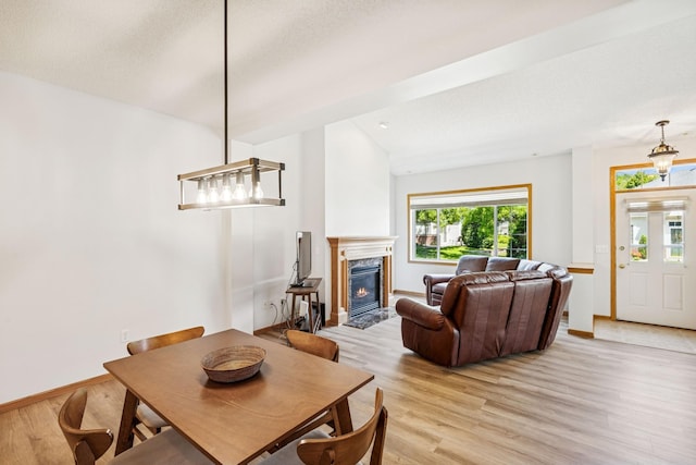 13936 54th Ave N Unit 2, Plymouth, MN 55446 - dining space featuring healthy amount of natural light, light wood finished floors, and a fireplace