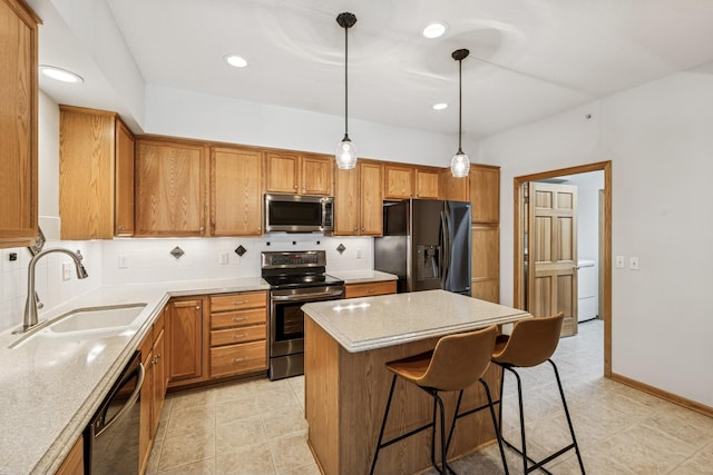 13936 54th Ave N Unit 2, Plymouth, MN 55446 - kitchen featuring black appliances, brown cabinets, a breakfast bar, light countertops, and a kitchen island