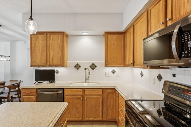 13936 54th Ave N Unit 2, Plymouth, MN 55446 - kitchen featuring appliances with stainless steel finishes, backsplash, light countertops, and brown cabinets