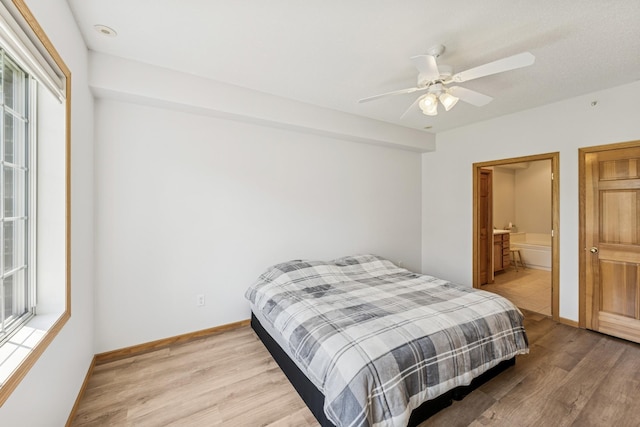 13936 54th Ave N Unit 2, Plymouth, MN 55446 - bedroom featuring light wood-type flooring, a ceiling fan, and ensuite bathroom