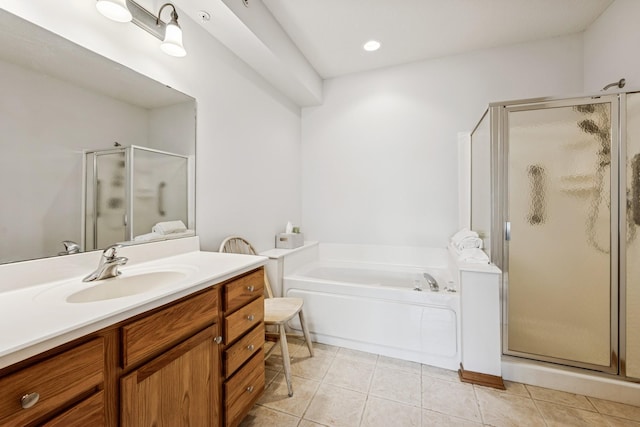13936 54th Ave N Unit 2, Plymouth, MN 55446 - full bath featuring a shower stall, vanity, a garden tub, and tile patterned flooring