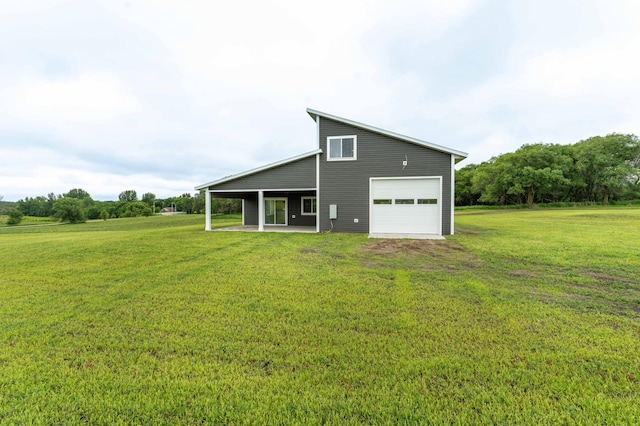 41565 Thunder Rd, Clitherall, MN 56524 - back of property with a garage, a yard, and a patio