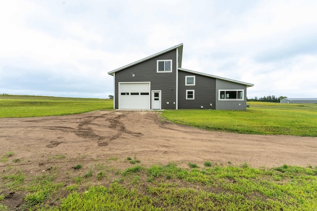 41565 Thunder Rd, Clitherall, MN 56524 - view of home's exterior featuring driveway, a lawn, and a garage